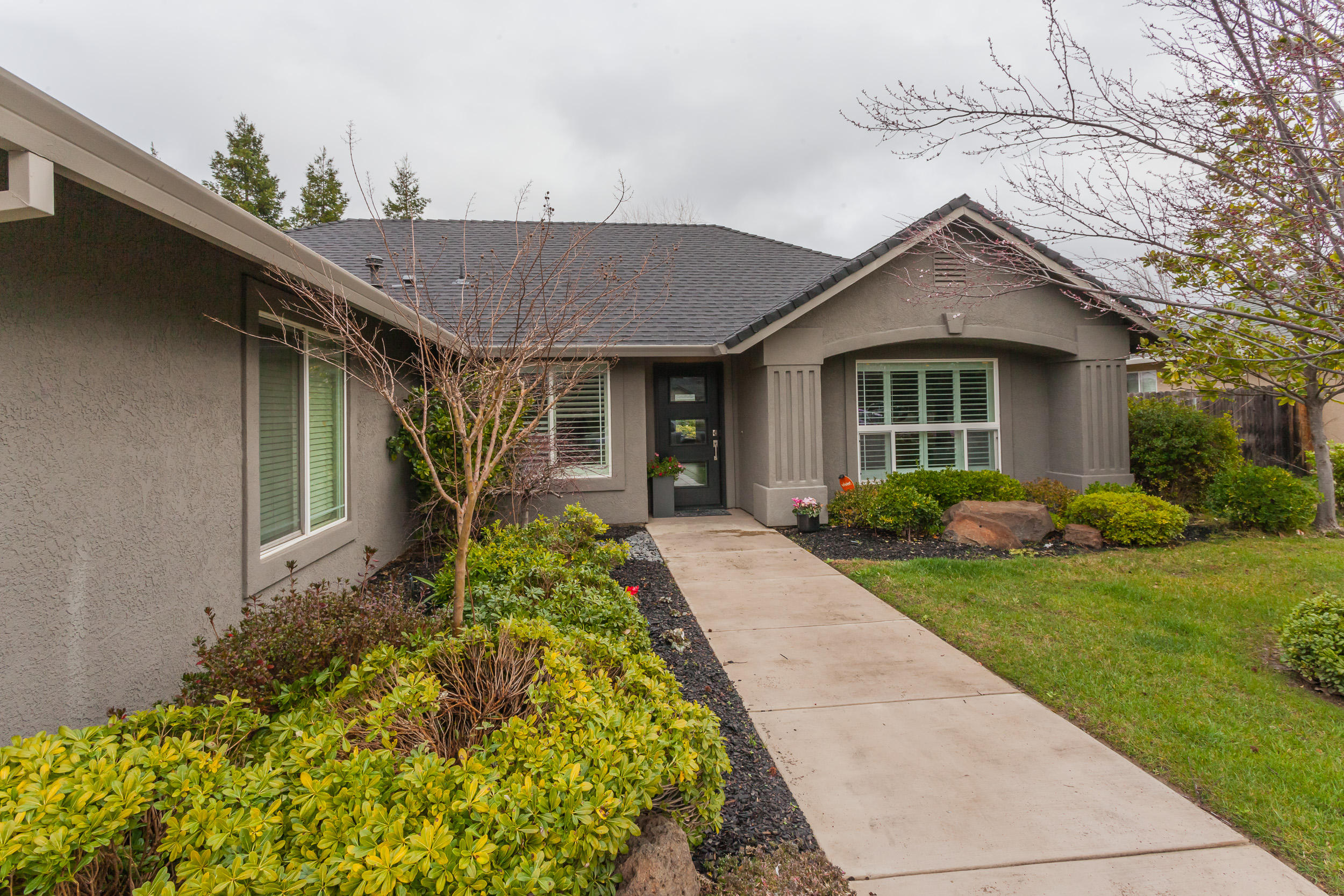 2638 Rhinestone Way Redding, CA 96001 - Photo 1 of 30 a front view of a house with garden