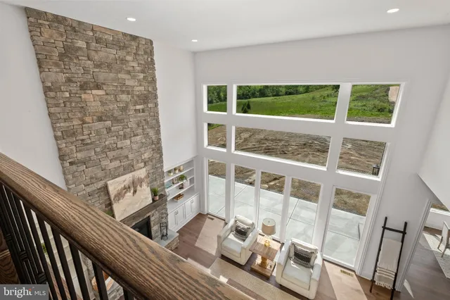 a view of an room with wooden floor and windows