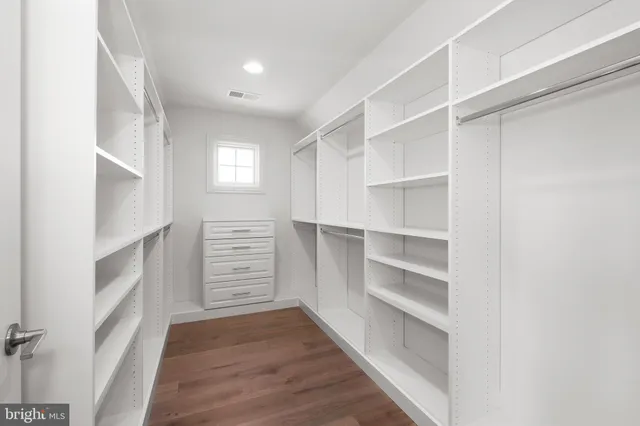 a view of an empty walk in closet