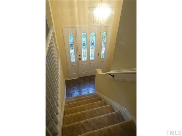 7124 Mill Ridge Road Raleigh, NC 27613 - Photo 15 of 23 Beautiful stained glass door and chandelier in this split foyer home.