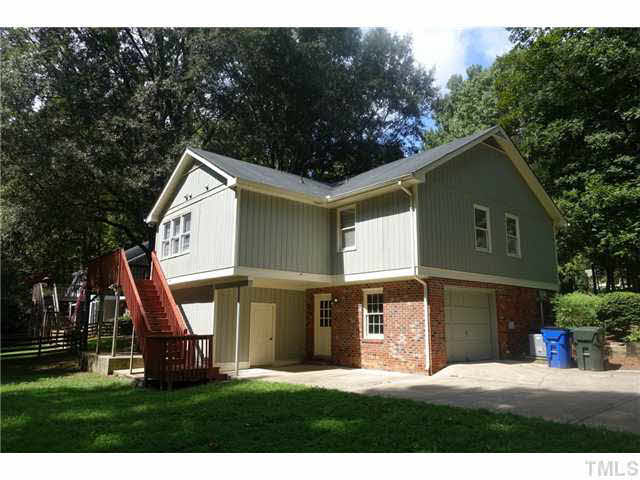 7124 Mill Ridge Road Raleigh, NC 27613 - Photo 20 of 23 You can exit and enter through the garage, sliding glass patio doors, or door off the deck. Easy access for the family.