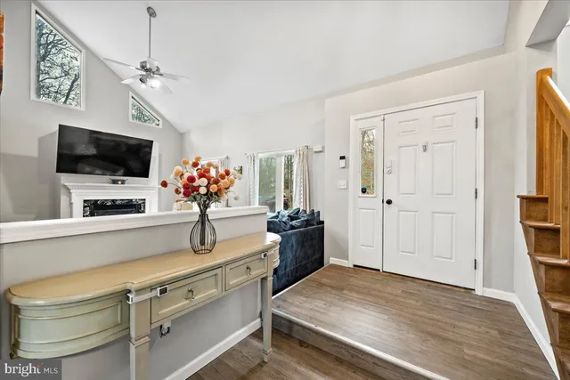 a dining room with furniture and wooden floor