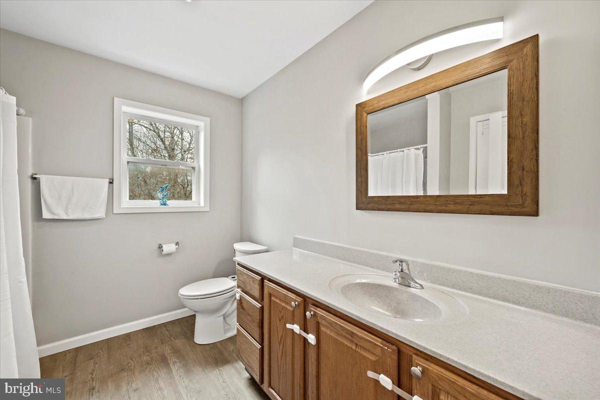 219 Mountain View Jim Thorpe, PA 18229 - Photo 25 of 38 a bathroom with a granite countertop sink toilet and mirror