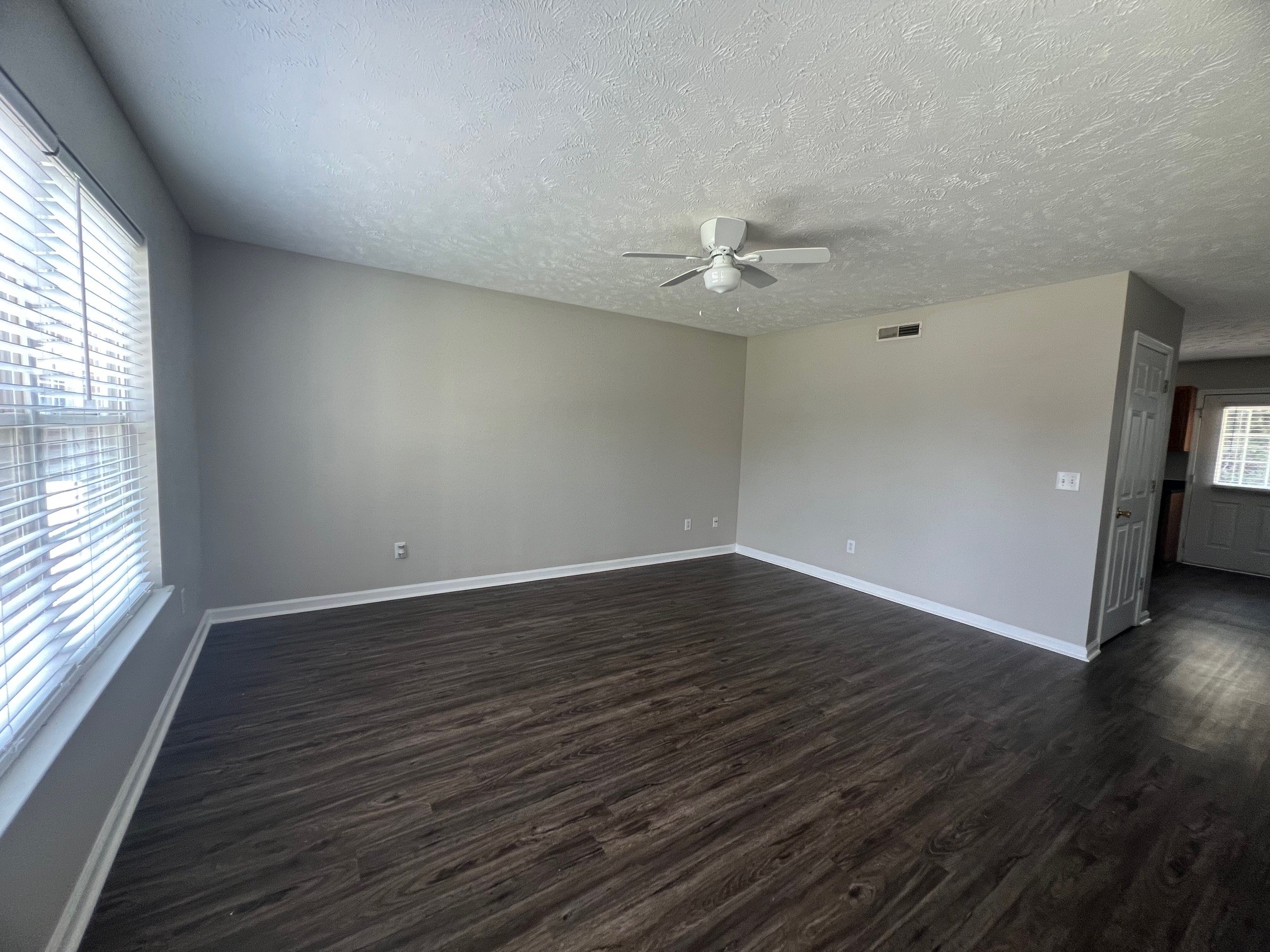 1503 Center Pointe Drive Murfreesboro, TN 37130 - Photo 2 of 17 a view of an empty room with wooden floor and a window