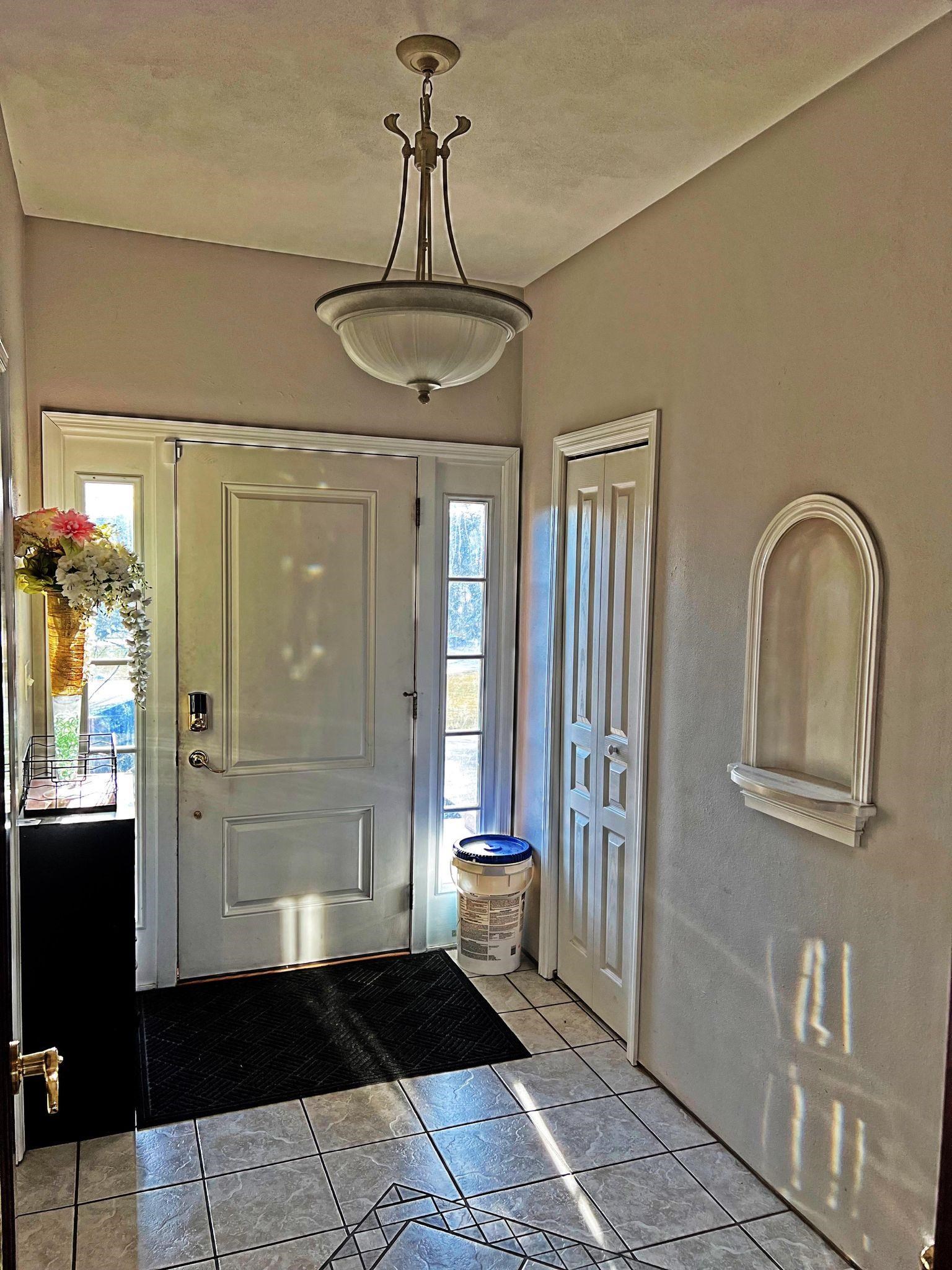 916 Olson Spring Close Belvidere, IL 61008 - Photo 2 of 32 a view of a hallway with windows