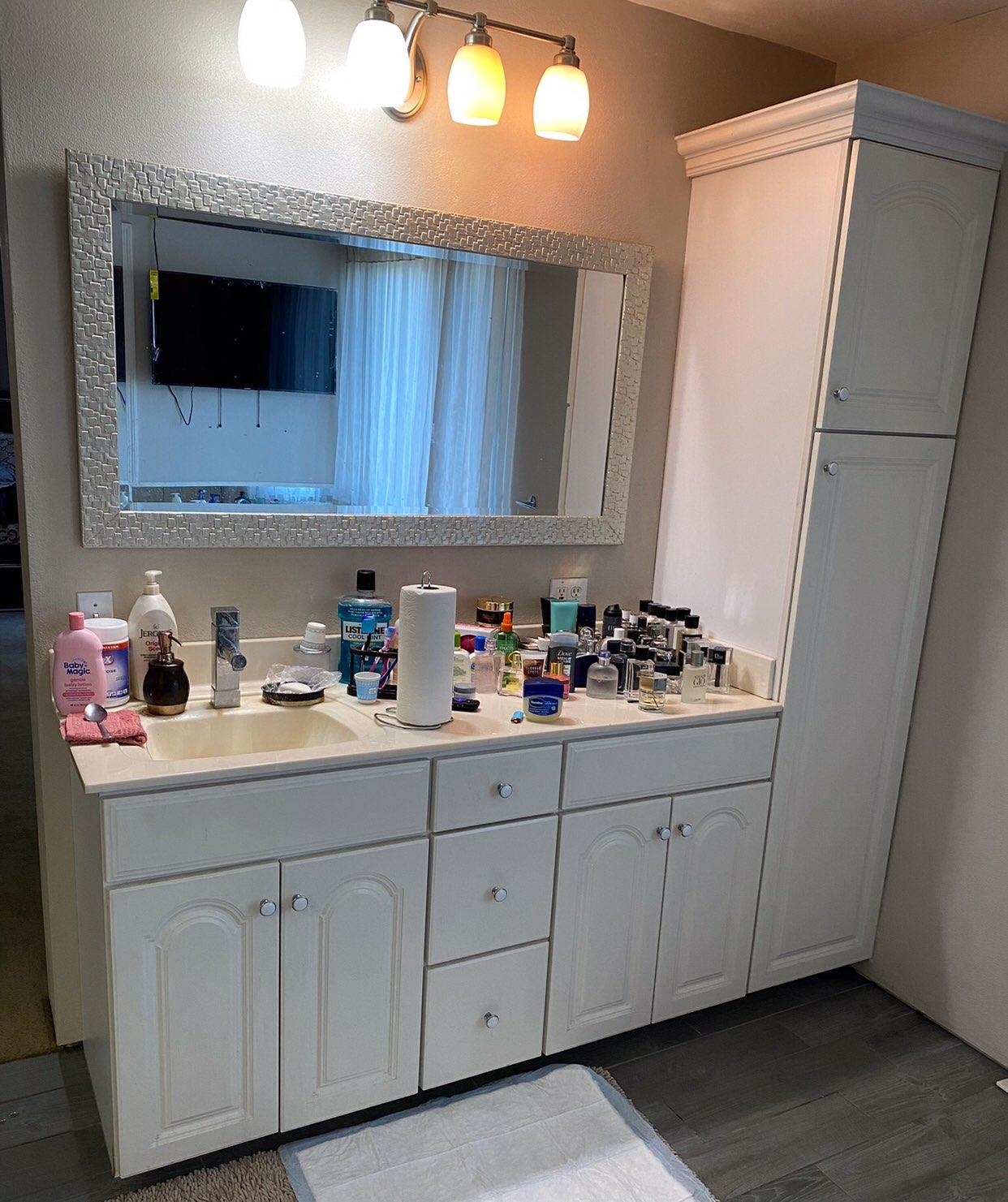 916 Olson Spring Close Belvidere, IL 61008 - Photo 32 of 32 a bathroom with a sink and a mirror