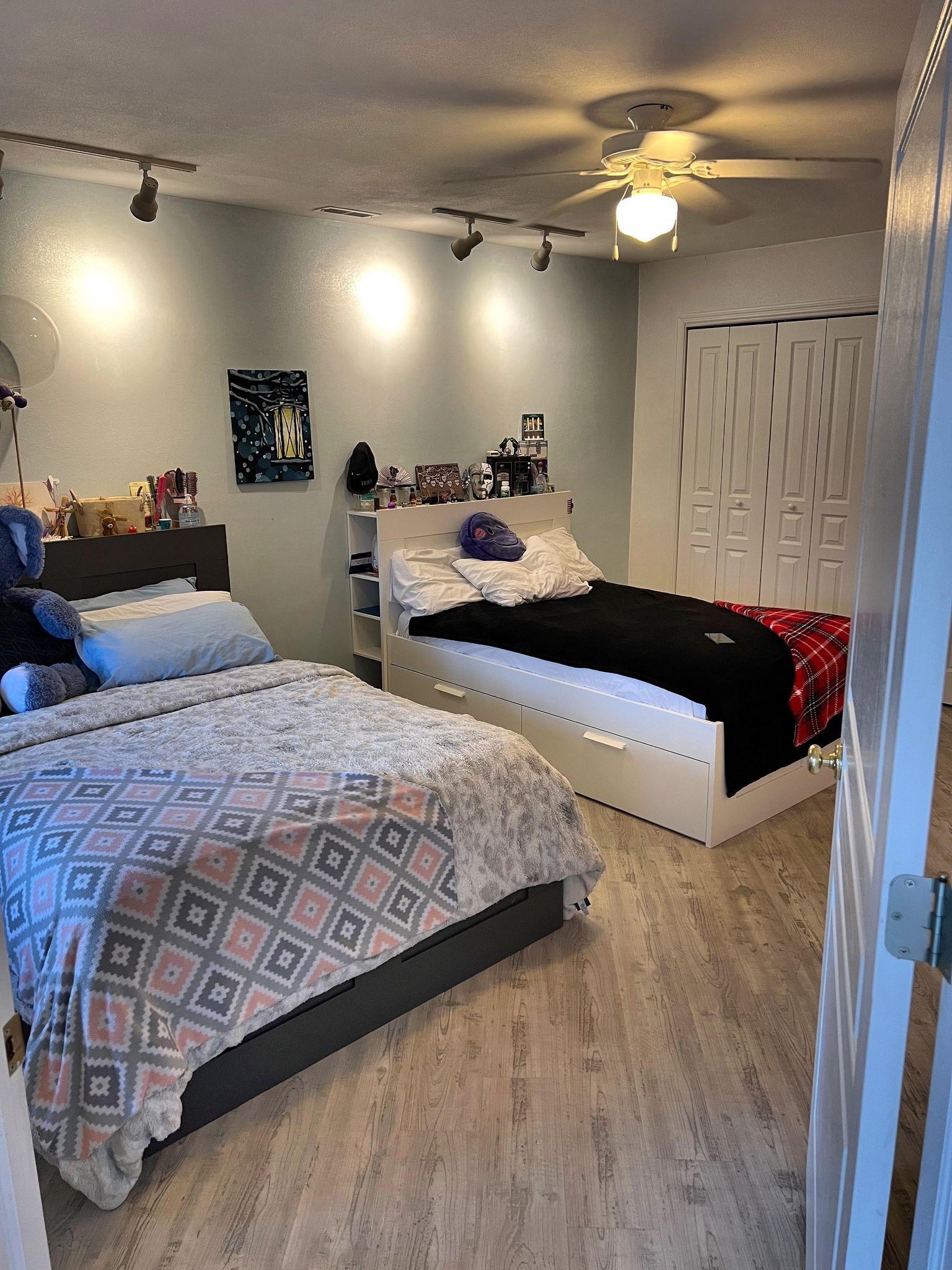 916 Olson Spring Close Belvidere, IL 61008 - Photo 8 of 32 a bedroom with double bed and a chandelier