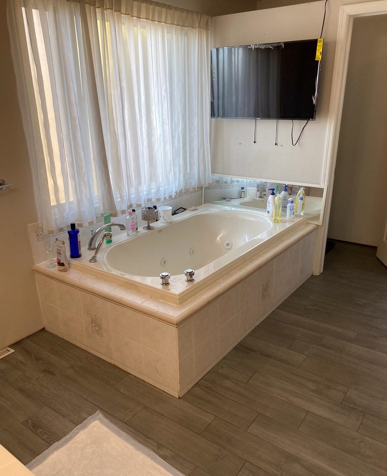 916 Olson Spring Close Belvidere, IL 61008 - Photo 10 of 32 a white bath tub sitting in a bathroom