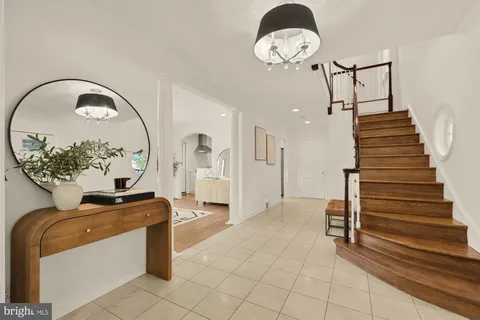 a spacious bedroom with a bed and a window