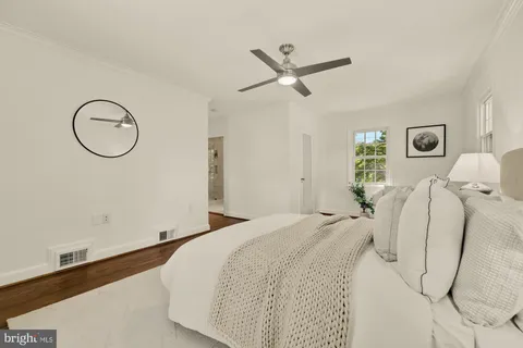 a view of a hallway with a view of living room