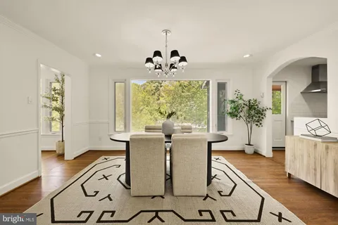 a kitchen with a sink appliances and cabinets