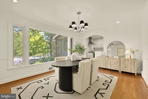 a kitchen with a stove and white cabinets
