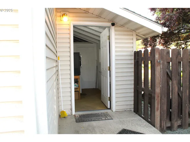 a view of a porch with a door and a yard