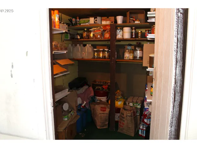 a view of a dining room with shelves