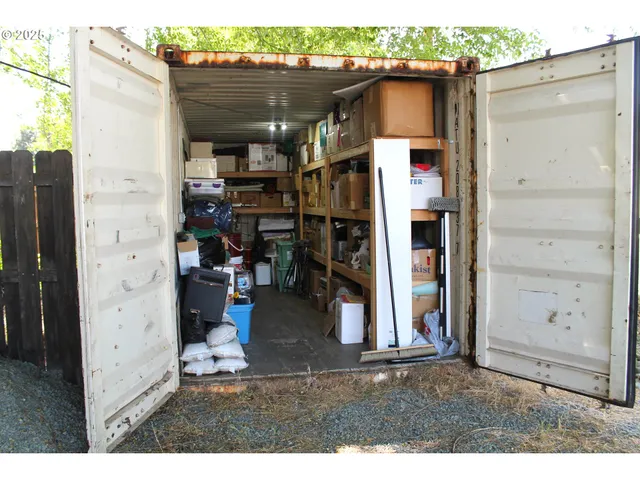 a view of backyard with outdoor seating and green space