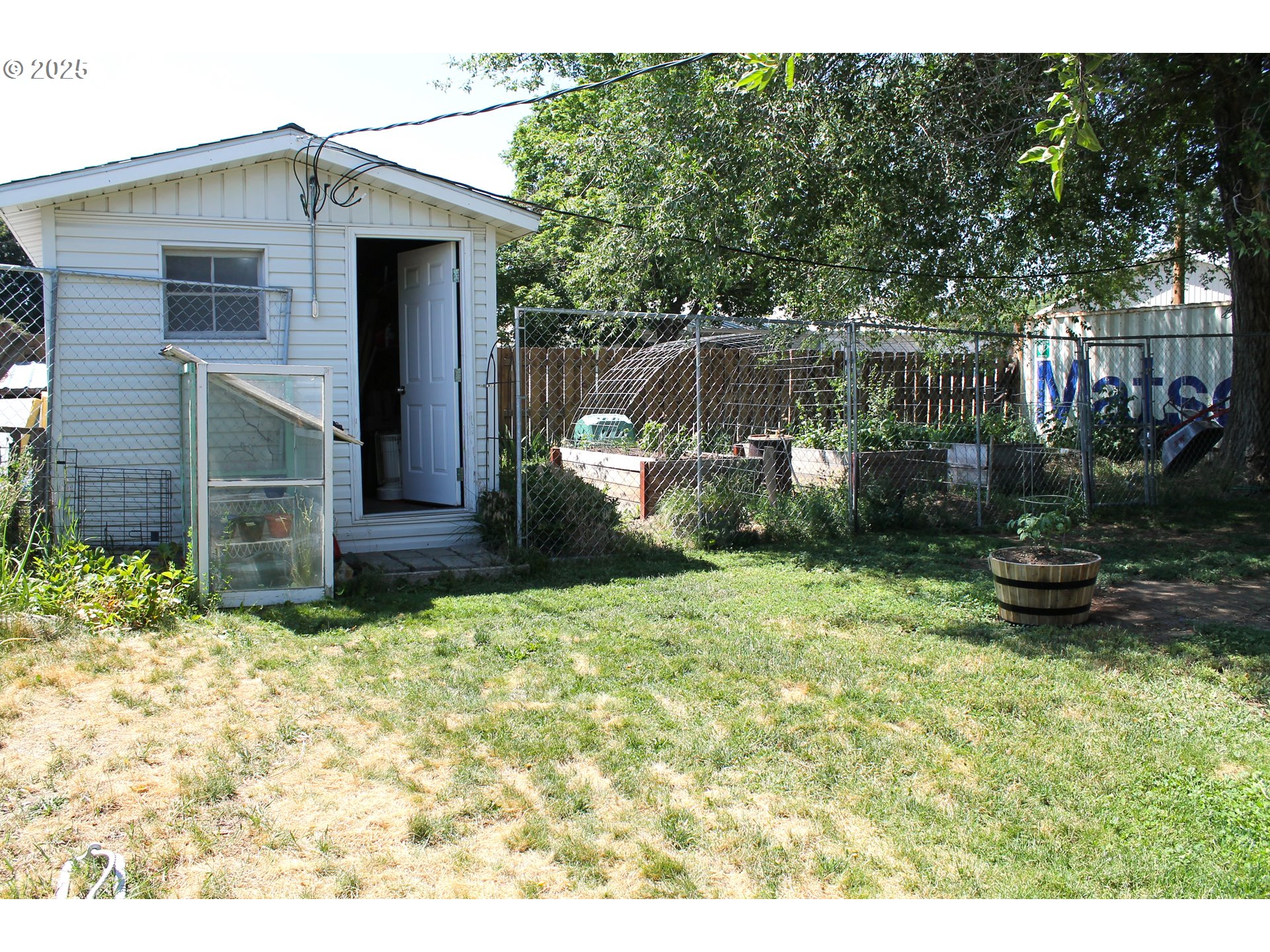 410 Northwest Bridge Street John Day, OR 97845 - Photo 15 of 19 a backyard of a house with barbeque oven fire pit table and chairs