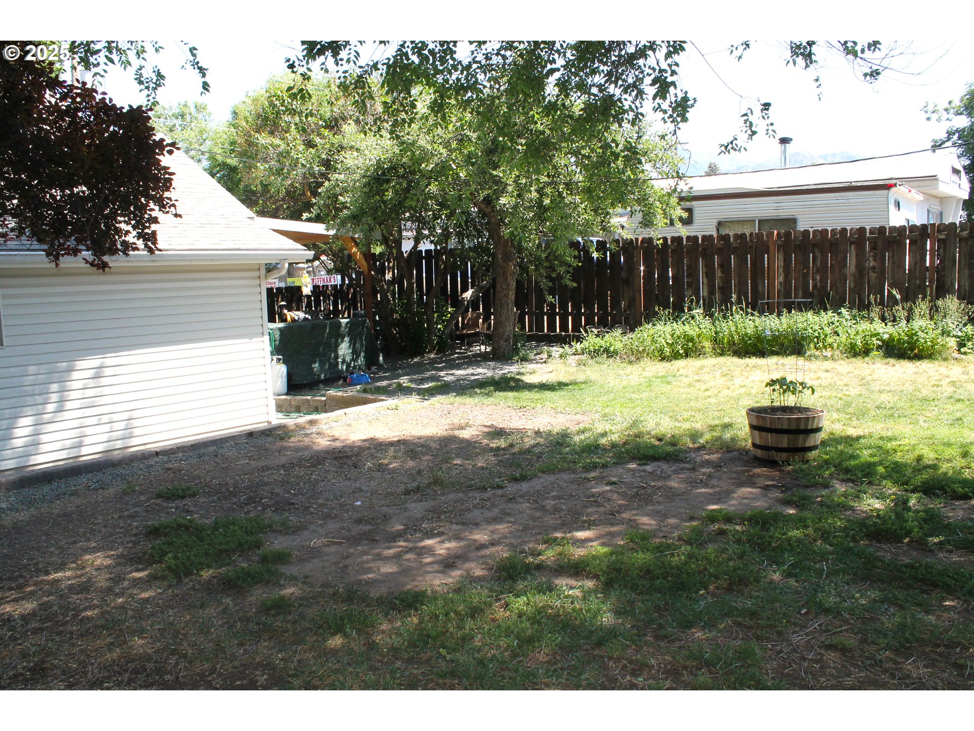 410 Northwest Bridge Street John Day, OR 97845 - Photo 18 of 19 a view of back yard of the house with green space