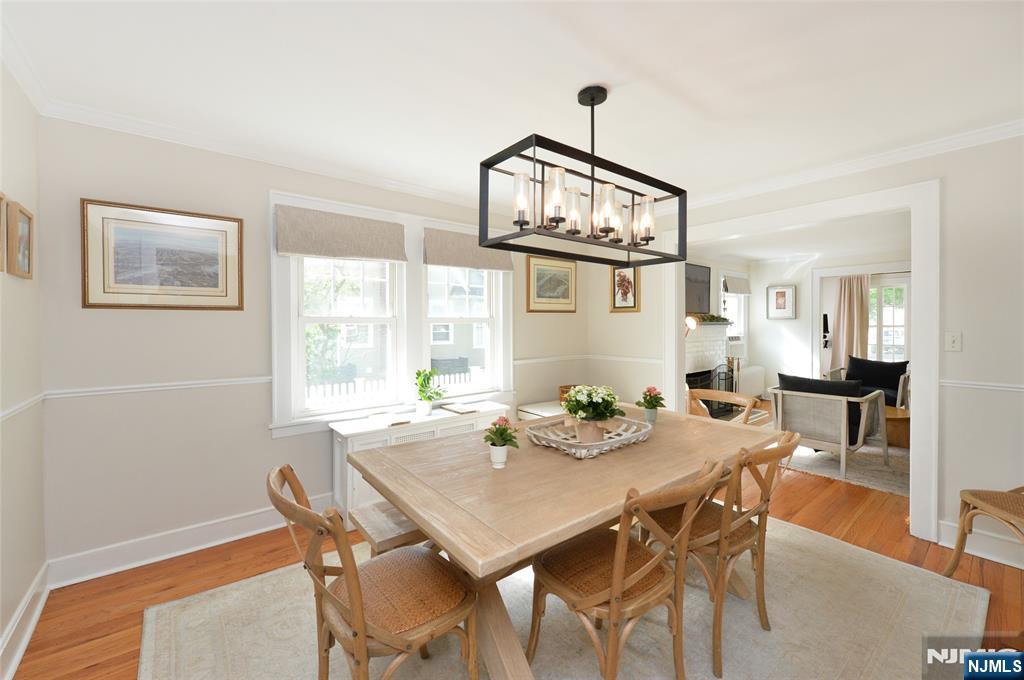 570 Shelton Road Ridgewood, NJ 07450 - Photo 7 of 26 a view of a dining room with furniture a chandelier and wooden floor