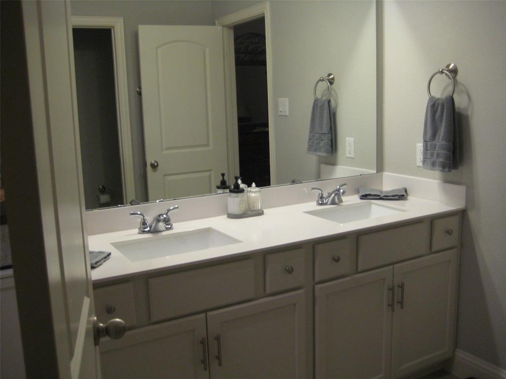 2 Grouse Run Sanger, TX 76266 - Photo 12 of 26 a bathroom with a double vanity sink and a mirror
