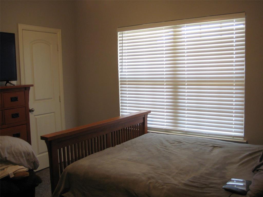 2 Grouse Run Sanger, TX 76266 - Photo 13 of 26 a bedroom with a bed and a window
