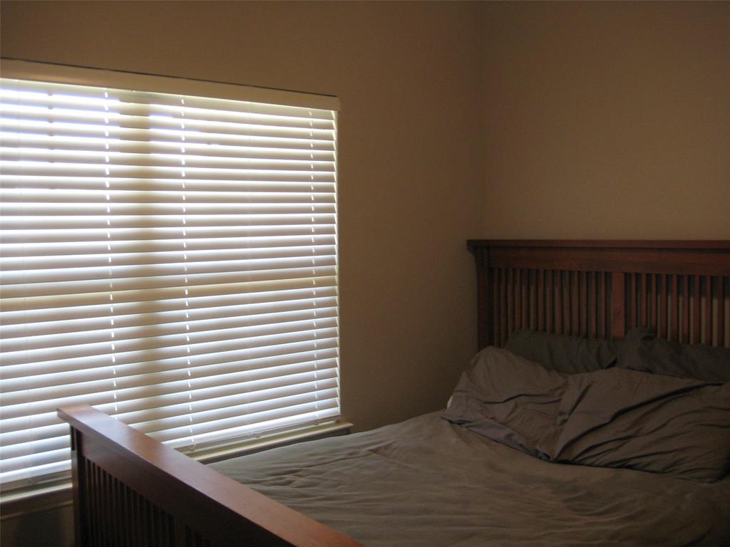 2 Grouse Run Sanger, TX 76266 - Photo 14 of 26 a bedroom with a bed and a window