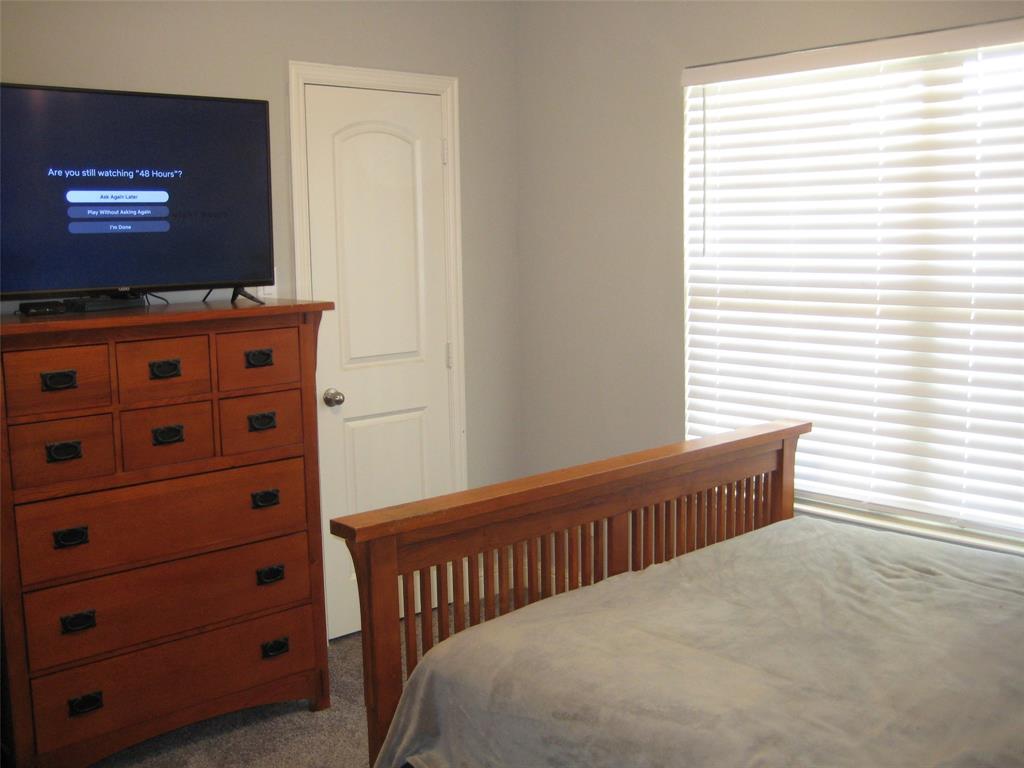 2 Grouse Run Sanger, TX 76266 - Photo 15 of 26 a bedroom with a bed and a window