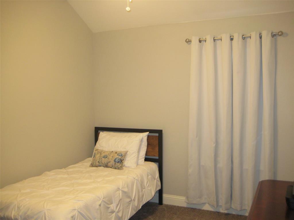 2 Grouse Run Sanger, TX 76266 - Photo 16 of 26 a bedroom with a bed and a chair