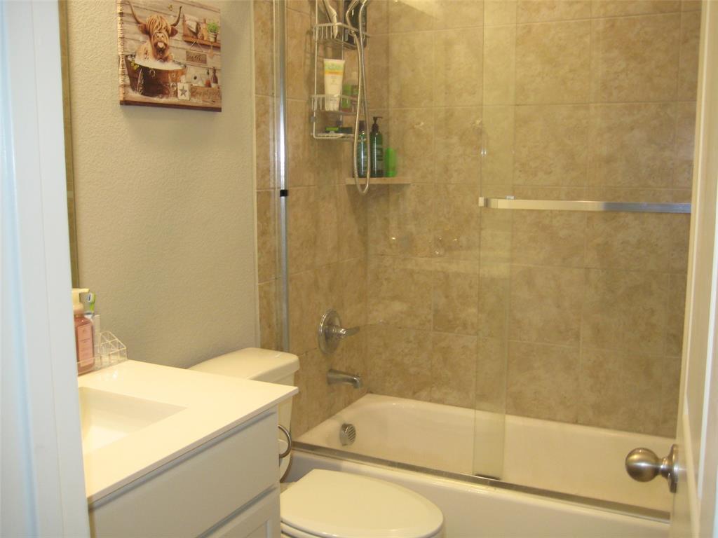 2 Grouse Run Sanger, TX 76266 - Photo 17 of 26 a bathroom with a toilet and a shower