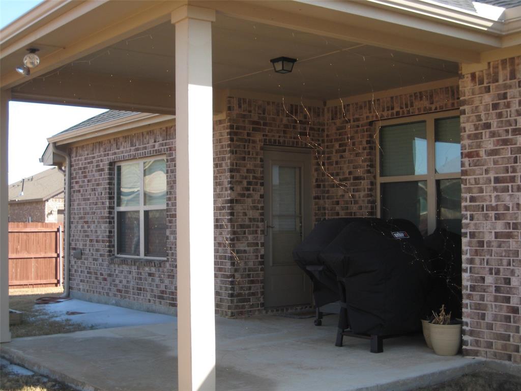 2 Grouse Run Sanger, TX 76266 - Photo 21 of 26 a front view of a house with a yard