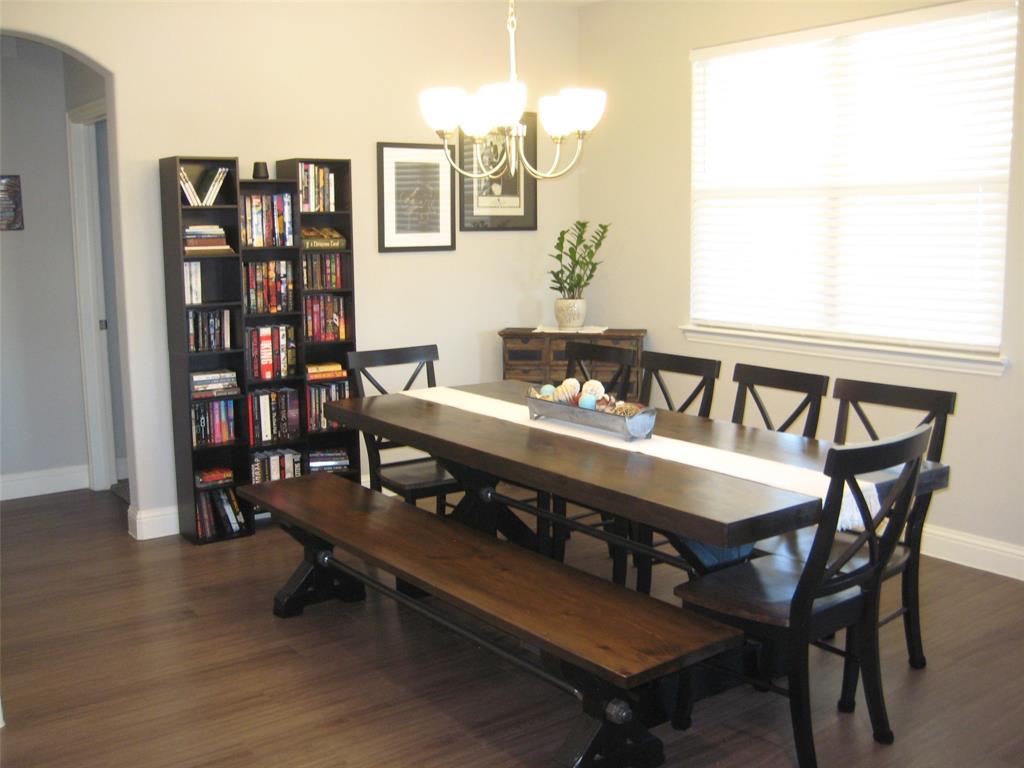 2 Grouse Run Sanger, TX 76266 - Photo 5 of 26 a view of a dining room with furniture and wooden floor
