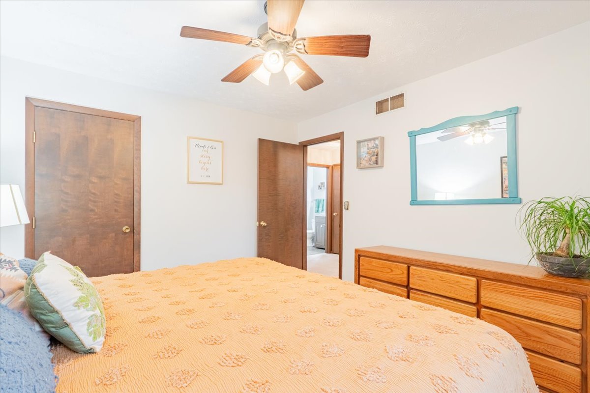 1014 North Fell Avenue Normal, IL 61761 - Photo 13 of 31 a bedroom with a bed and a chandelier