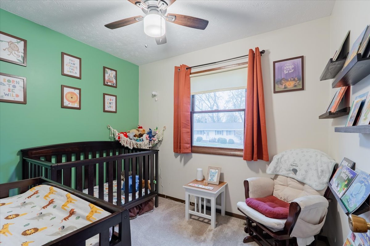 1014 North Fell Avenue Normal, IL 61761 - Photo 16 of 31 a bedroom with furniture and a window