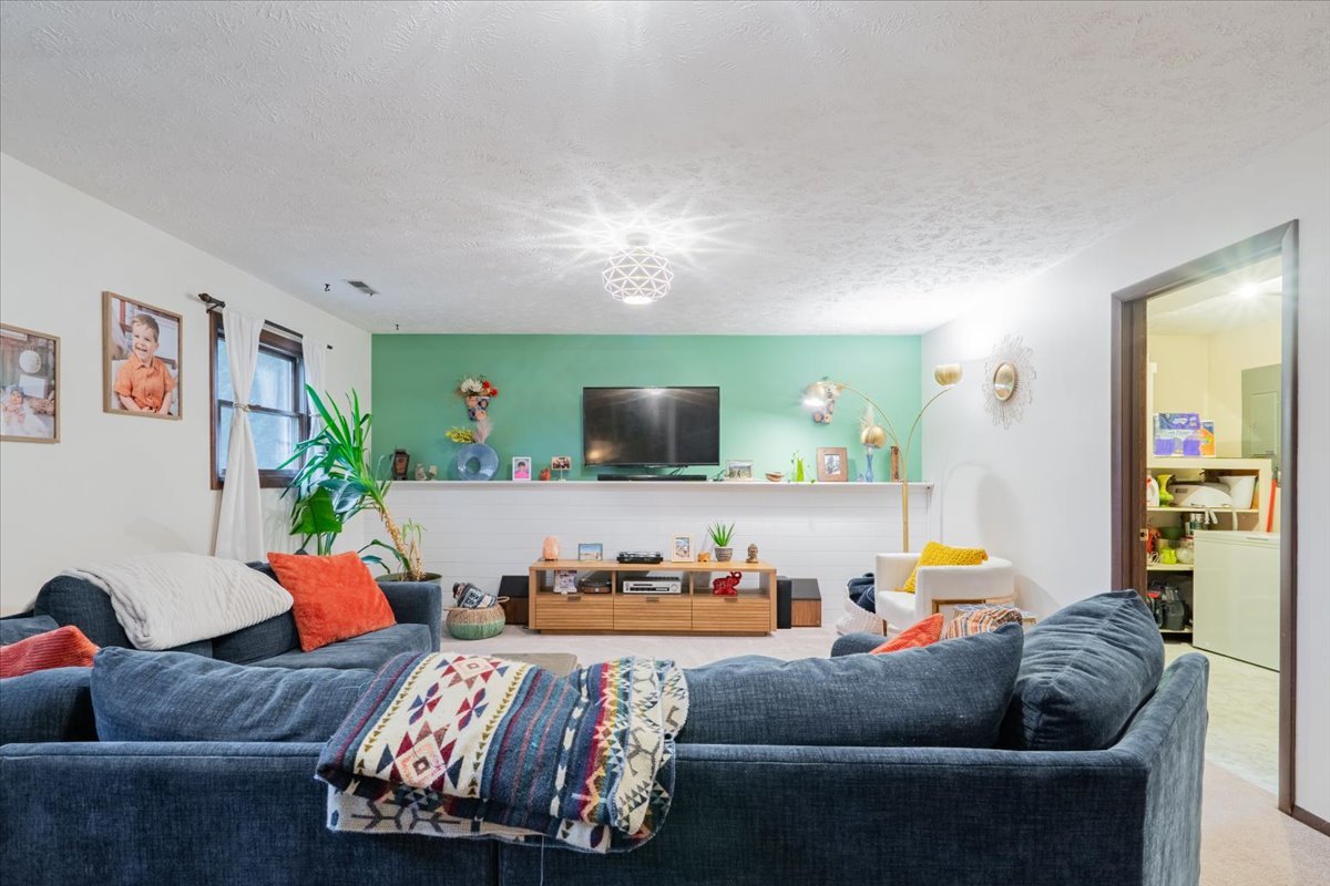 1014 North Fell Avenue Normal, IL 61761 - Photo 20 of 31 a living room with furniture and a flat screen tv