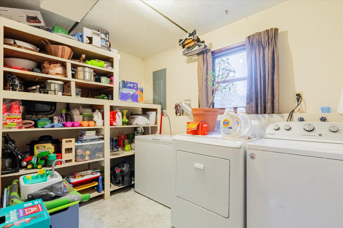 1014 North Fell Avenue Normal, IL 61761 - Photo 23 of 31 a utility room with dryer and book shelf