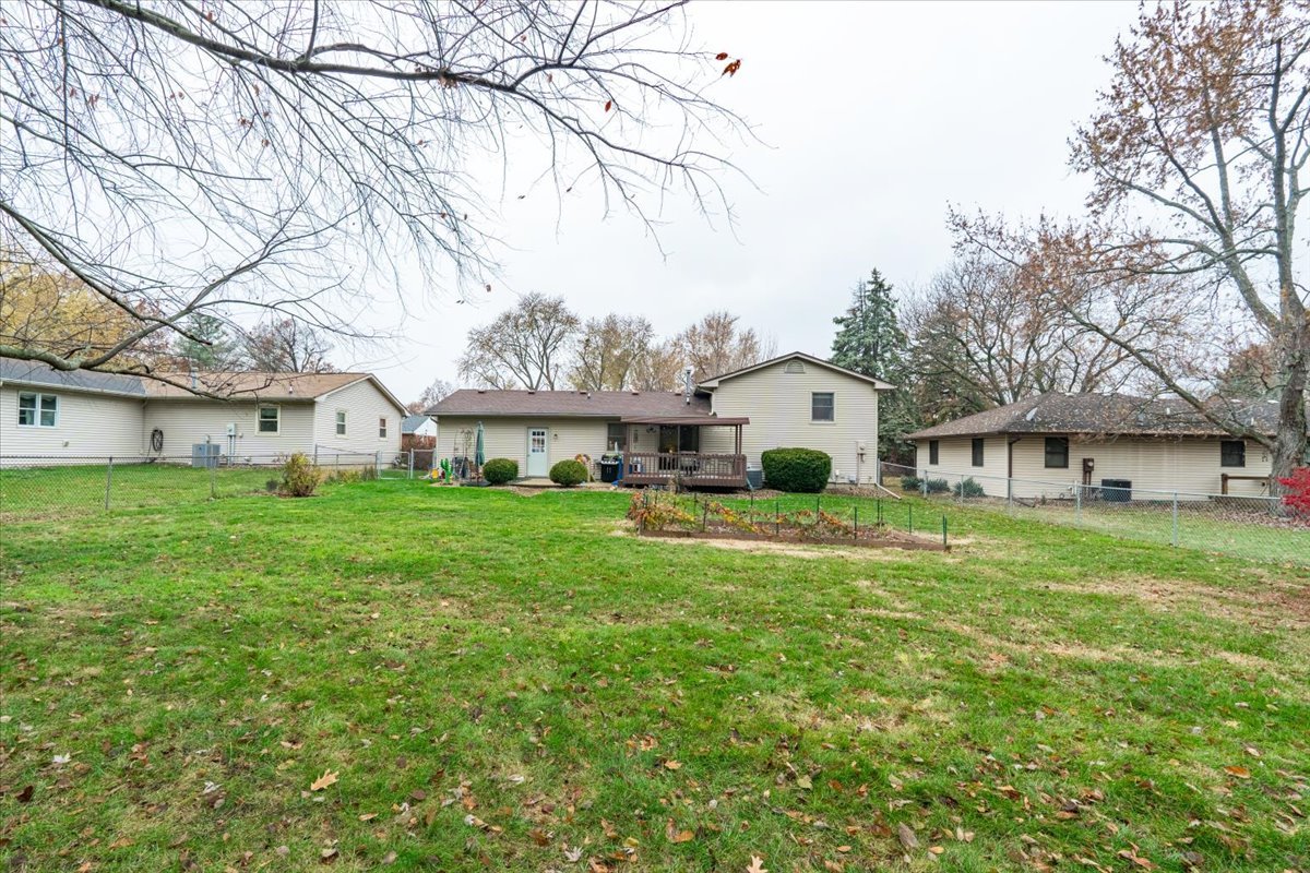 1014 North Fell Avenue Normal, IL 61761 - Photo 28 of 31 a front view of a house with a garden and trees