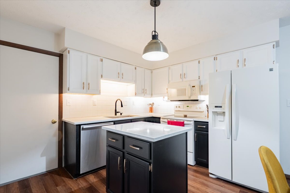 1014 North Fell Avenue Normal, IL 61761 - Photo 10 of 31 a kitchen with a sink a stove a refrigerator and cabinets