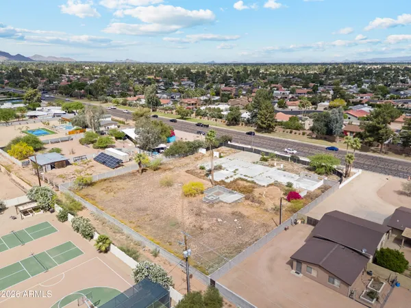 an aerial view of residential houses with outdoor space