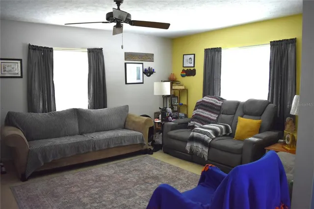 a living room with furniture and a window