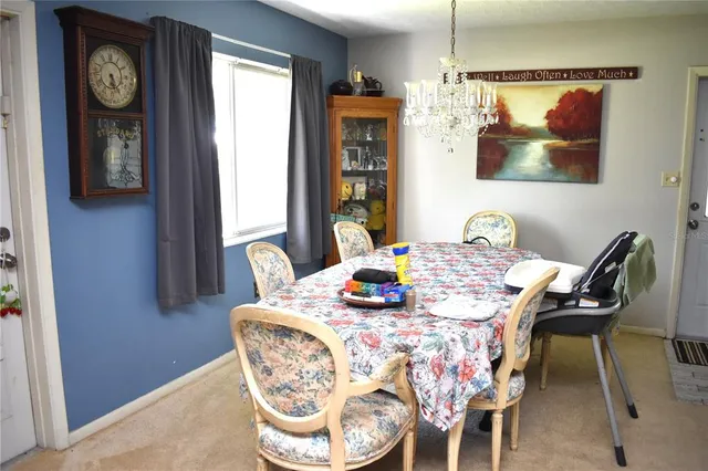 a dining room with furniture and window