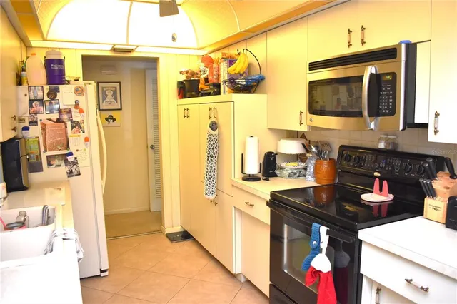 a kitchen with stainless steel appliances granite countertop a sink and cabinets