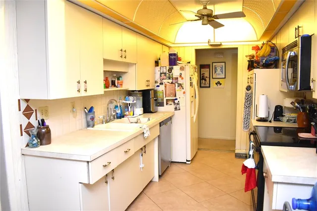 a utility room with sink dryer and washer