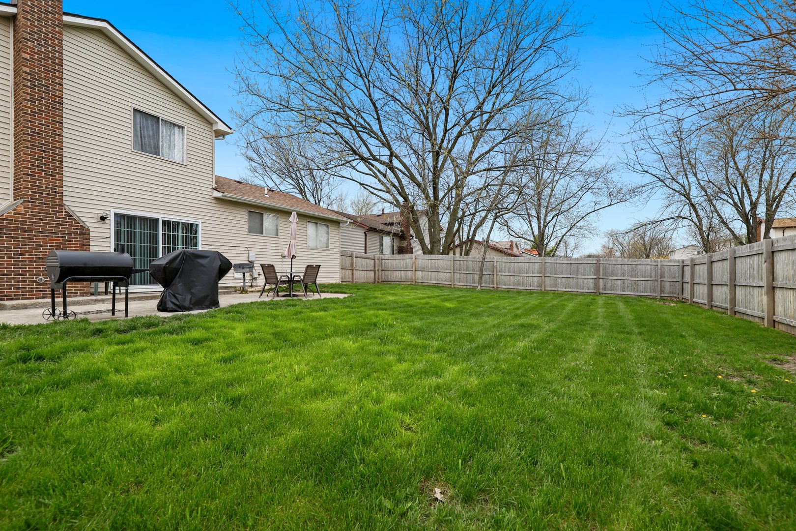223 Pheasant Road Matteson, IL 60443 - Photo 17 of 19 a view of a backyard with garden and plants