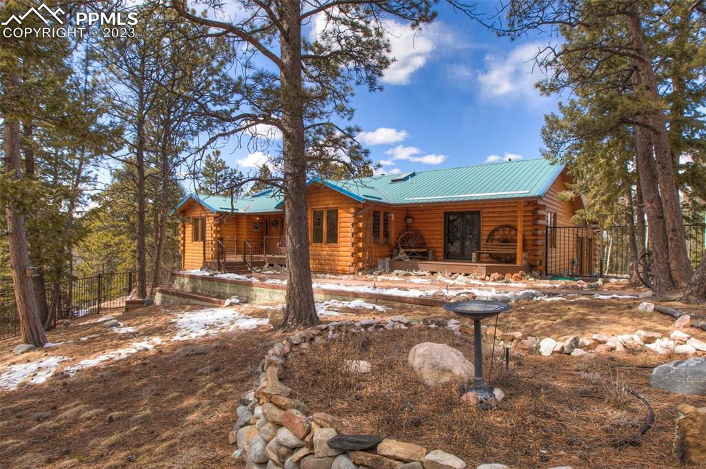 265 Broken Wheel Drive Divide, CO 80814 - Photo 1 of 50 a view of a house with backyard porch and sitting area