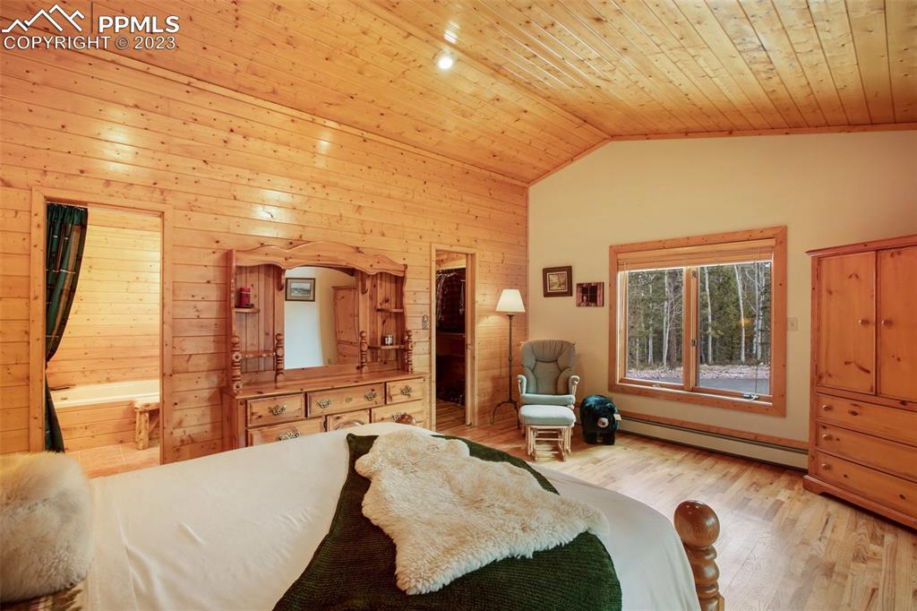 265 Broken Wheel Drive Divide, CO 80814 - Photo 12 of 50 a bedroom with furniture and a large window