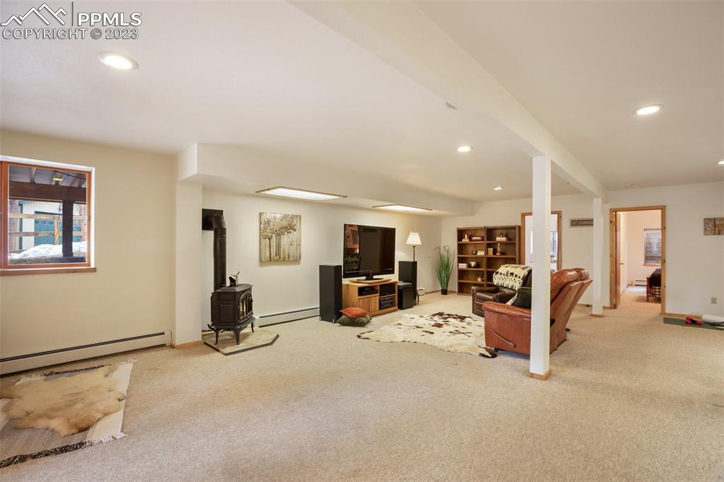265 Broken Wheel Drive Divide, CO 80814 - Photo 23 of 50 a view of a livingroom with furniture and a flat screen tv