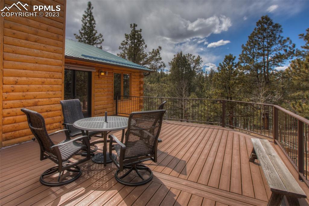 265 Broken Wheel Drive Divide, CO 80814 - Photo 32 of 50 a view of balcony with wooden floor and outdoor seating
