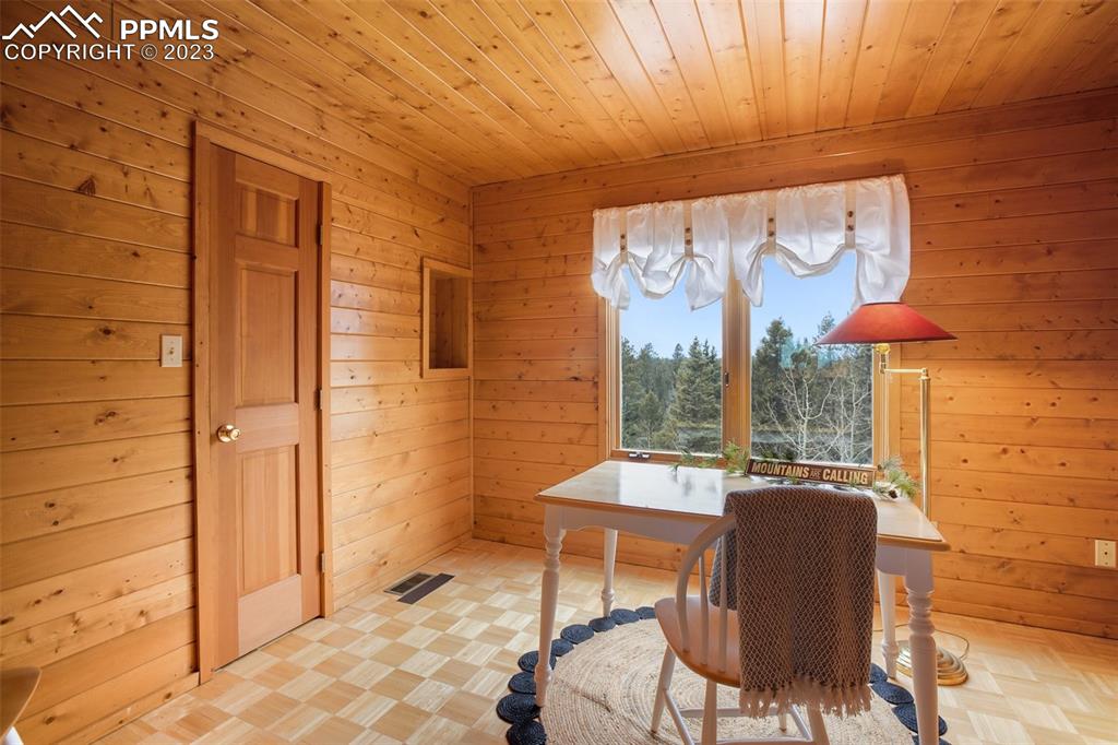 265 Broken Wheel Drive Divide, CO 80814 - Photo 36 of 50 a dining room with furniture and a window
