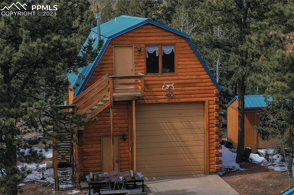 265 Broken Wheel Drive Divide, CO 80814 - Photo 39 of 50 a view of a house with a garage