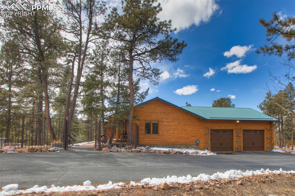 265 Broken Wheel Drive Divide, CO 80814 - Photo 48 of 50 a front view of a house with a yard