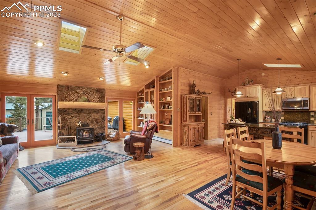265 Broken Wheel Drive Divide, CO 80814 - Photo 8 of 50 a living room with fireplace furniture and a wooden floor